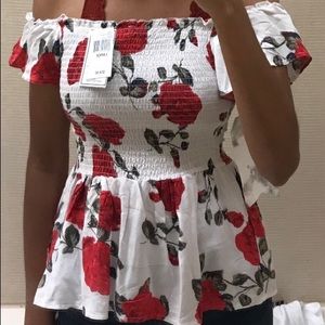 A cute white off the shoulder smocked floral top!!